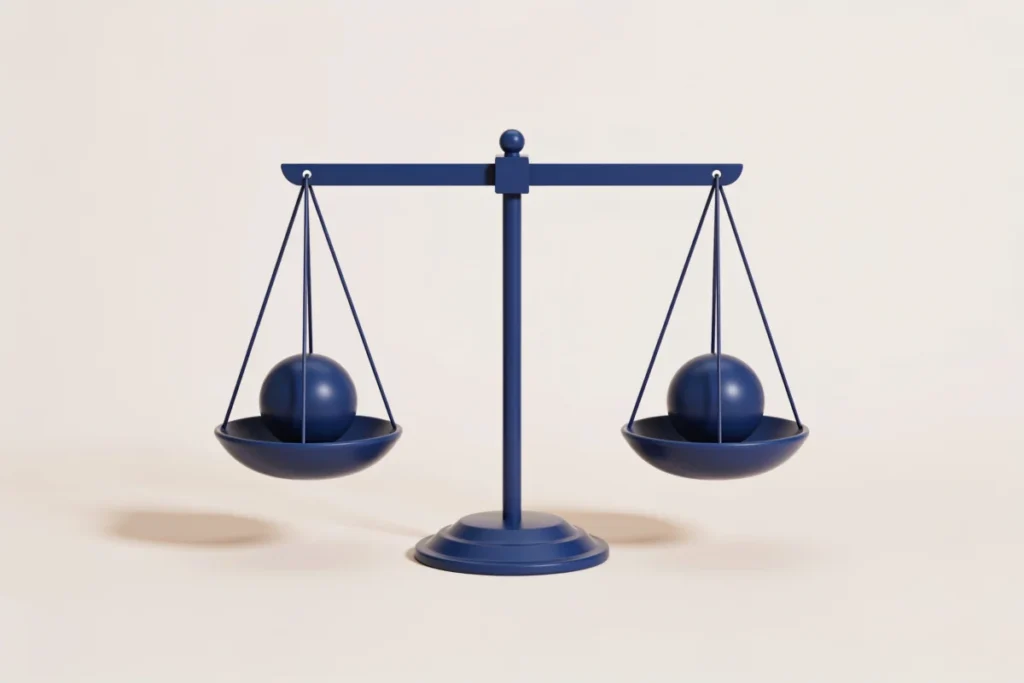 A balanced navy scale weighing two similar spheres, representing index funds versus ETFs